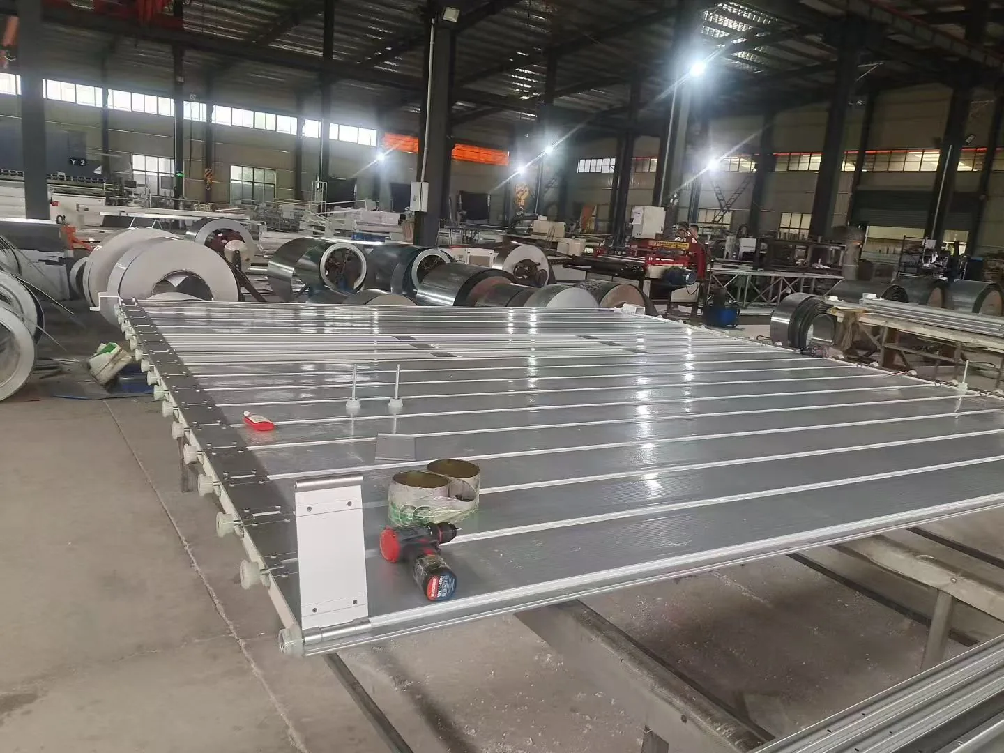 Commercial rolling shutter door assembled on a factory floor