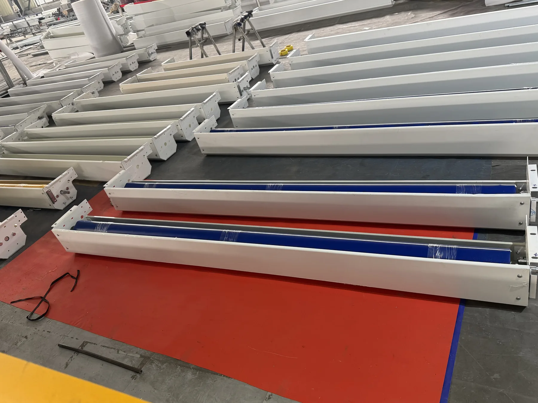 Custom rolling shutter door components arranged for project production